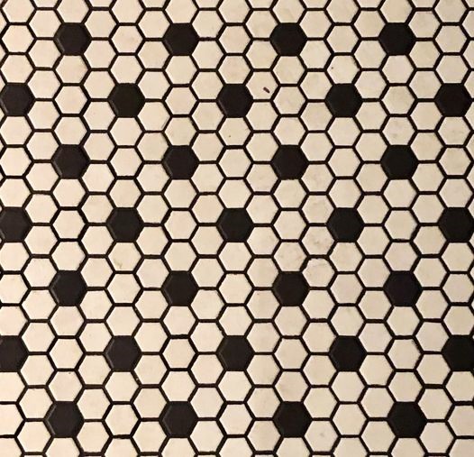 Math challenge: In this infinite tiling pattern, what fraction of the tiles are black?